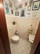 Gäste WC - Familienfreundliche 3-Zimmerwohnung mit Balkon und Garage in zentraler Lage