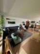 Wohnzimmer - Familienfreundliche 3-Zimmerwohnung mit Balkon und Garage in zentraler Lage